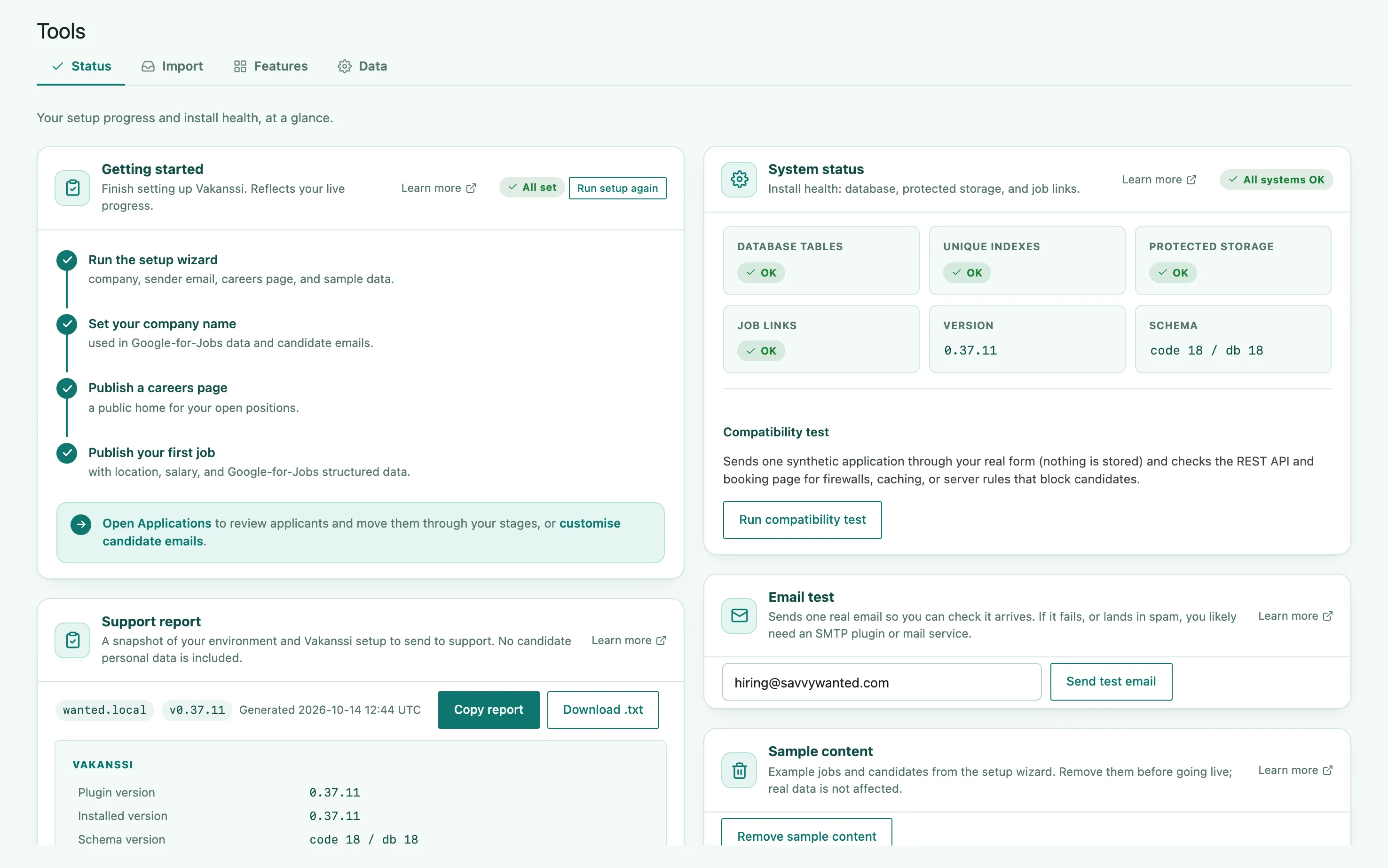 The Status tab, showing system-health tiles for database tables, unique indexes, protected storage, job links, version, and schema